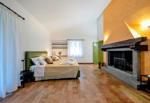 Ένα ή περισσότερα κρεβάτια σε δωμάτιο στο Podere Fonte Luxury Country House