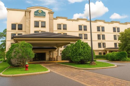 a hotel with a red fire hydrant in front of it at La Quinta by Wyndham Port Orange / Daytona in Port Orange