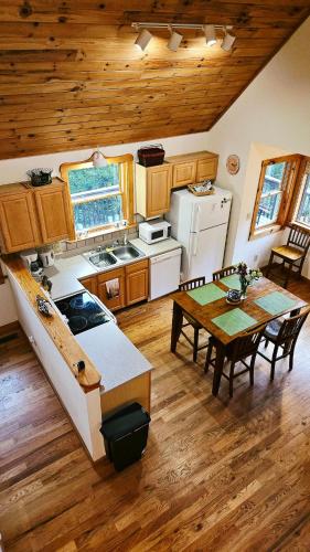an overhead view of a kitchen with a table and a dining room at Chapel Rest - Breathtaking Views in Boone