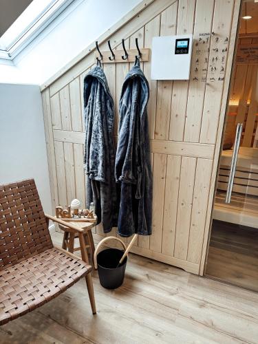 a room with coats hanging on a wall at Bachgeflüster-Suite in Bad Koetzting