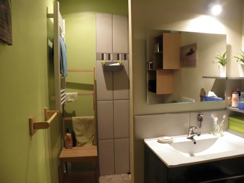 a bathroom with a sink and a mirror at Les Althéas - Gîte En Ardèche in Chandolas