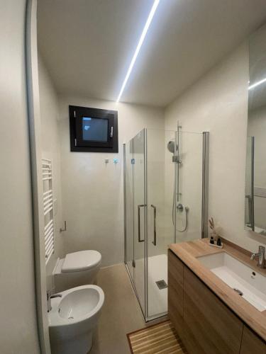 a bathroom with a toilet and a sink and a shower at Colle del Mare in Gabicce Mare