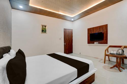 Ένα ή περισσότερα κρεβάτια σε δωμάτιο στο Hotel O Asthara