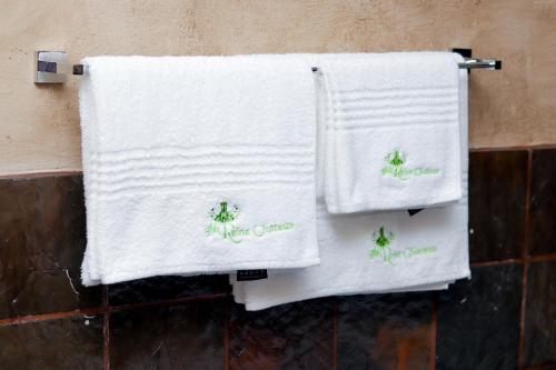two towels hanging on a towel rack in a bathroom at GBL Reine Chateau in Polokwane