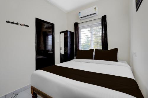 Postel nebo postele na pokoji v ubytování Hotel O ELITE STAY