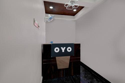 a sign that says oxy on a wall in a room at Hotel O De' BVL Grand in Hyderabad