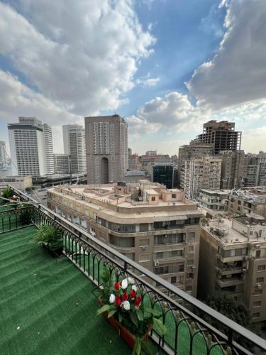 a view of a city from a balcony at Downtown Luxury Suites - Partial Nile View in Cairo