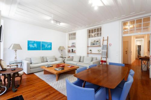 a living room with a table and a couch at Camões - Bairro Alto - by The Portuguese Story in Lisbon