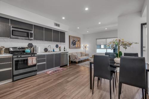 a kitchen and dining room with a table and chairs at Amazing, Spacious Unit, Heart LA in Los Angeles