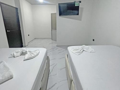 Ένα ή περισσότερα κρεβάτια σε δωμάτιο στο Club Campestre Villa Isabel