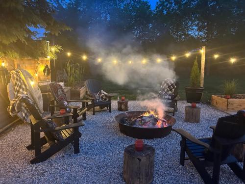 a fire pit in the middle of a patio at night at The Klinck House in Collingwood
