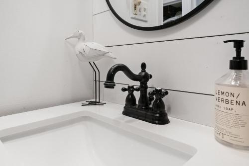 a bathroom sink with a bird on a faucet at Margate Home w/ Large Outdoor Kitchen in Margate City