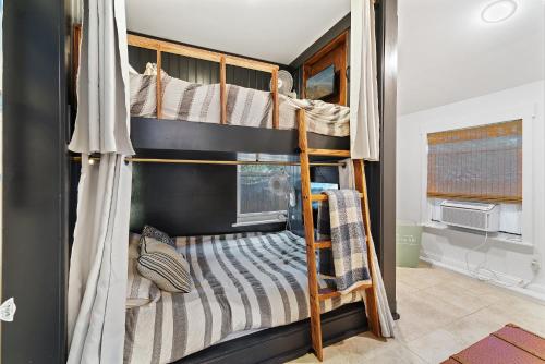a couple of bunk beds in a room at Margate Home w/ Large Outdoor Kitchen in Margate City