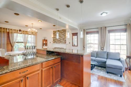 a kitchen with a counter and a living room at Take Metro to DC! Family Home in Springfield in Franconia