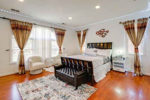 a bedroom with a bed and a couch and a chair at Take Metro to DC! Family Home in Springfield in Franconia