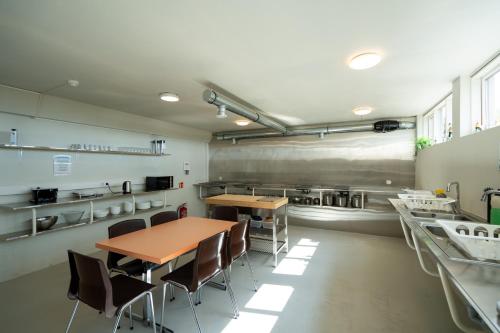 A kitchen or kitchenette at Skogar Hostel