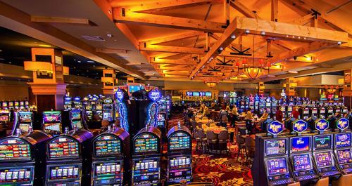 a casino filled with lots of slot machines at Oxford Casino Hotel in Oxford