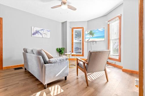 a living room with a couch and two chairs at Main Floor Tremont Home with KING Bed, Mins From DT, Pet Friendly in Cleveland