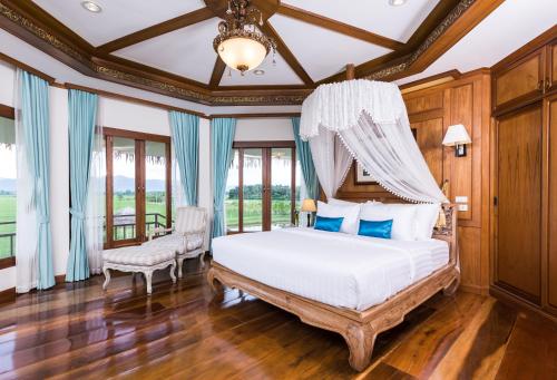 Katil atau katil-katil dalam bilik di Phusanfah Resort
