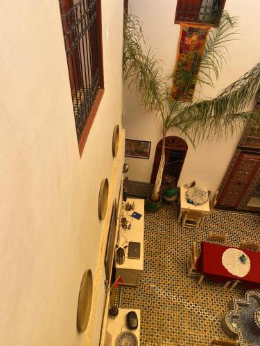 an overhead view of a living room with a guitar at Riad Iman in Fès