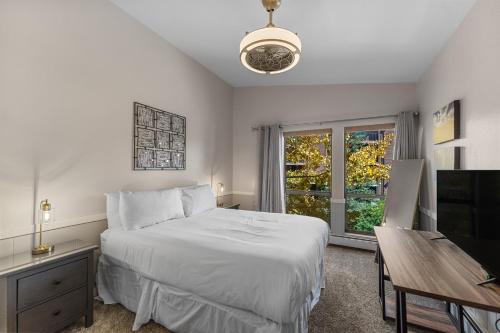 a bedroom with a bed and a desk and a television at Lake Cliffe #305 Building A in Dillon
