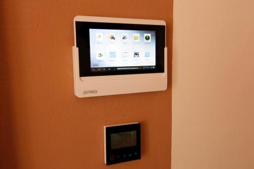 an apple tv attached to a wall with an outlet at Zin D Home Otel Cekmeköy in Istanbul