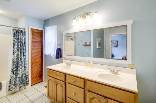 a bathroom with a sink and a mirror at Cozy Home with Spacious Yard 2 Mi to Dtwn Bristol in Bristol