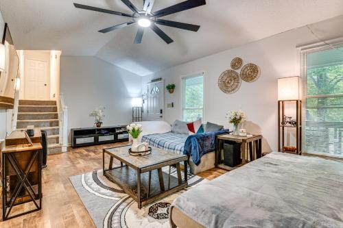 a living room with a couch and a ceiling fan at Easy I-20 Access to ATL Suburban Retreat with Yard in Douglasville