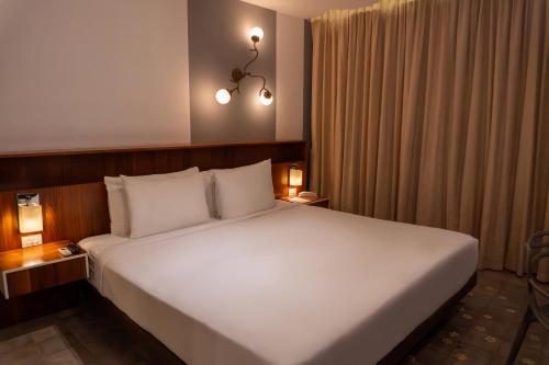 Postel nebo postele na pokoji v ubytování Flor de Mayo Hotel & Restaurant