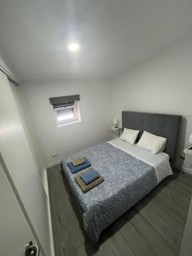 a bedroom with a bed with a tray on it at Casa do Ferrador in Moura