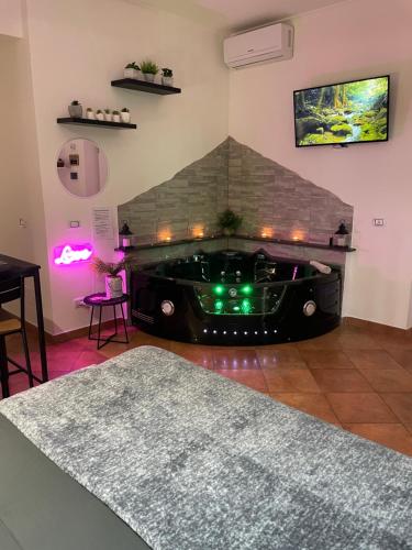a black car sitting in a room with a fireplace at Room24 Relax & Wellness in Genzano di Roma