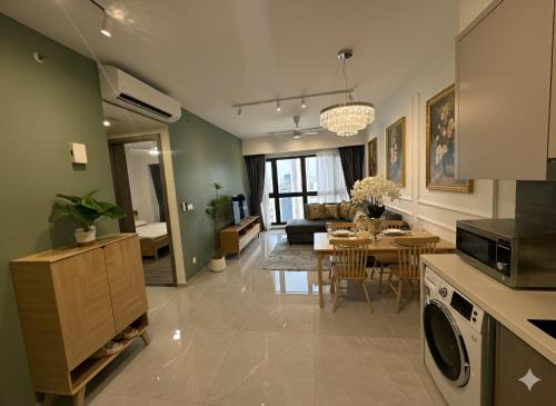 a kitchen and living room with a dining room at Luxury Suites - Agile Residence Bukit Bintang in Kuala Lumpur