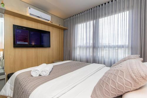 Postel nebo postele na pokoji v ubytování Studio Super Completo em Região Tranquila -EIX0402