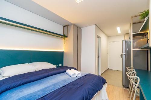 Postel nebo postele na pokoji v ubytování Studio Completo em Região Tranquila - EIX0502