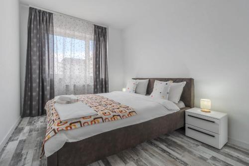 Postel nebo postele na pokoji v ubytování Home Guest - Apartment 12