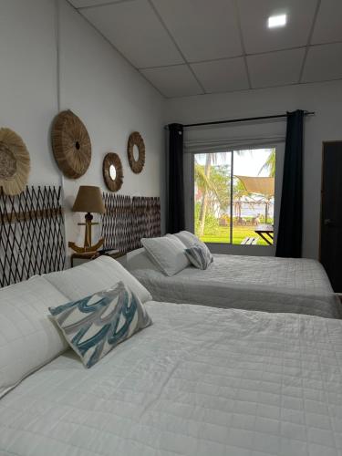 Ένα ή περισσότερα κρεβάτια σε δωμάτιο στο Lali Beach Hotel Boutique