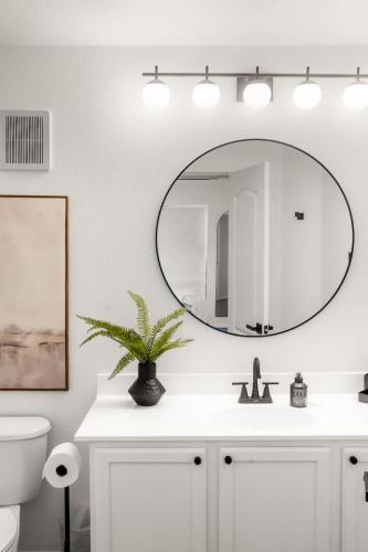 a bathroom with a sink and a mirror at Freestanding Cubs Retreat near ASU off L-101 & 202 in Tempe