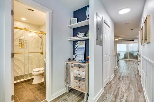 a bathroom with a toilet and a shower at Poolside Fun + Oceanfront Bliss: Kure Beach Haven! in Kure Beach