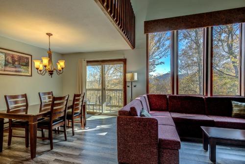 a living room with a couch and a table at The Highlands at Sugar in Banner Elk
