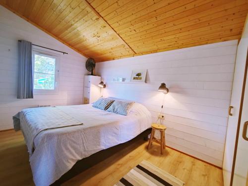 Ένα ή περισσότερα κρεβάτια σε δωμάτιο στο Chalet Cozy - Clim - Vue Pyrénées