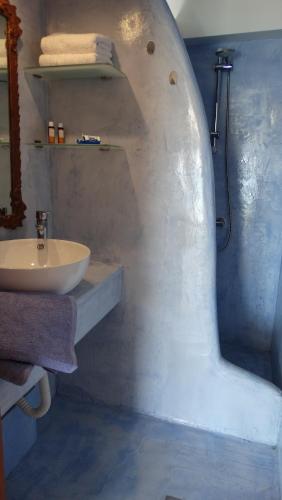 a bathroom with a sink and a shower at Dolichi View in Pythagoreio