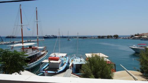 a group of boats docked in a harbor at Dolichi View in Pythagoreio