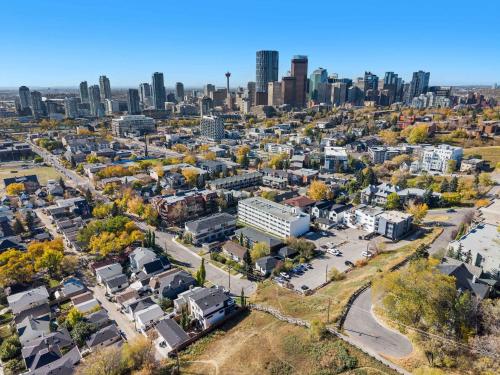 an aerial view of a city with a city skyline at Inner-City Chic Urban Farmhouse 3 Bds and Ba in Calgary
