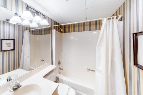 a bathroom with a sink and a shower at Triton's Trumpet B 303 in Ocean City