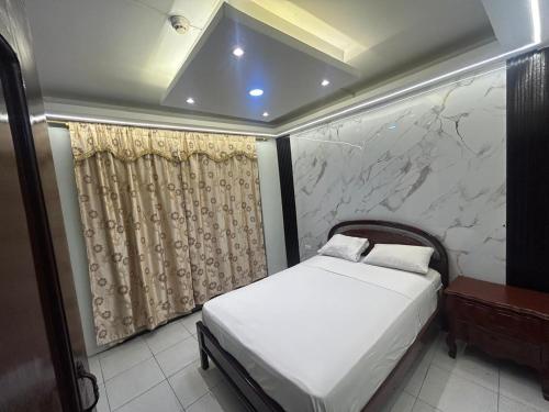 Ένα ή περισσότερα κρεβάτια σε δωμάτιο στο Hotel tower one