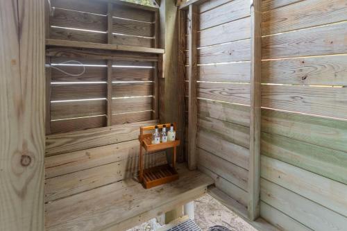 a sauna with wooden walls and a wooden shelf at The Emerald Belle in Emerald Isle