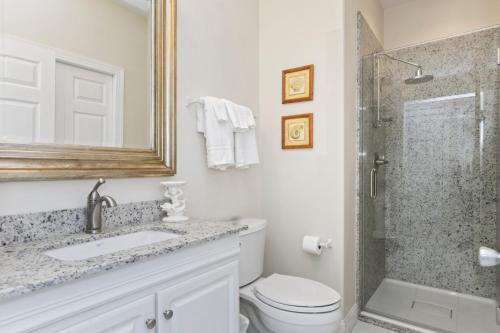 a bathroom with a toilet and a sink and a shower at Ocean Club I-202 in Indian Beach