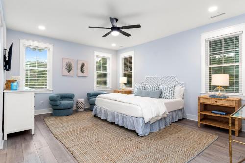 a bedroom with a bed and a ceiling fan at Afterdune Delight in Cedar Point