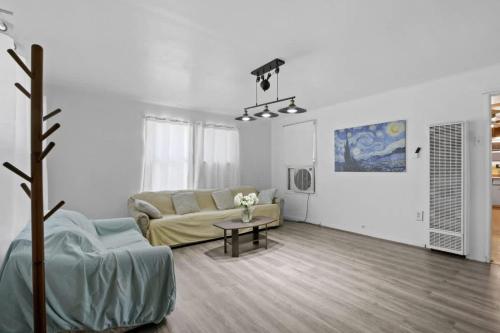 a living room with a couch and a table at 2BR Pet-Friendly Home # RV FREE in Upland