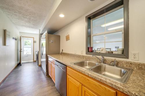 a kitchen with a sink and a window at 8-Acre Bridgman Oasis Pool, Hot Tub and Game Room in Bridgman